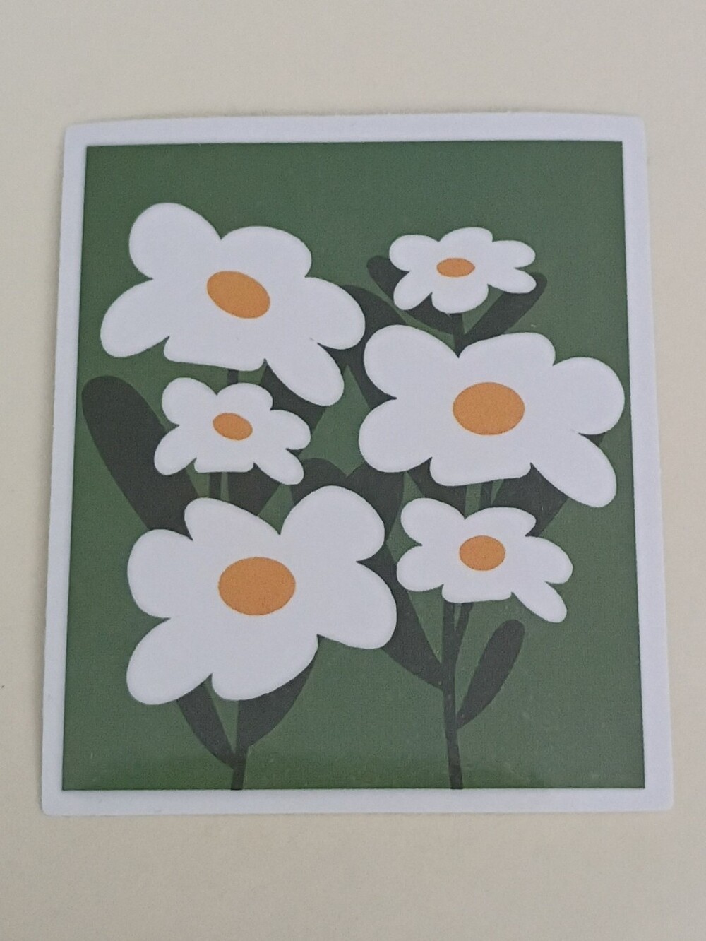 10/$10 Sticker - Multiple White Daisy Flowers On Green Background